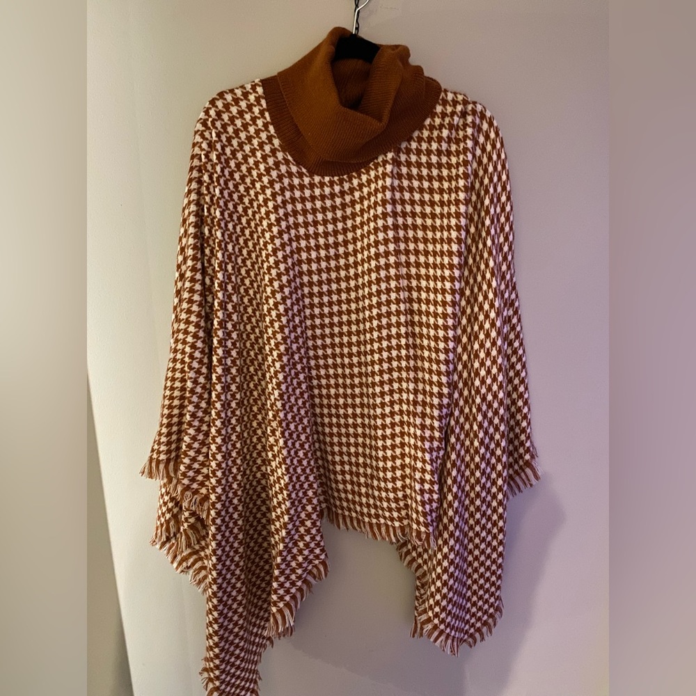 Burnt orange turtleneck poncho.